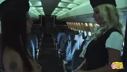 Two Naughty Flight Attendants Show Their Pussies to Each Other and Bang with a Dildo