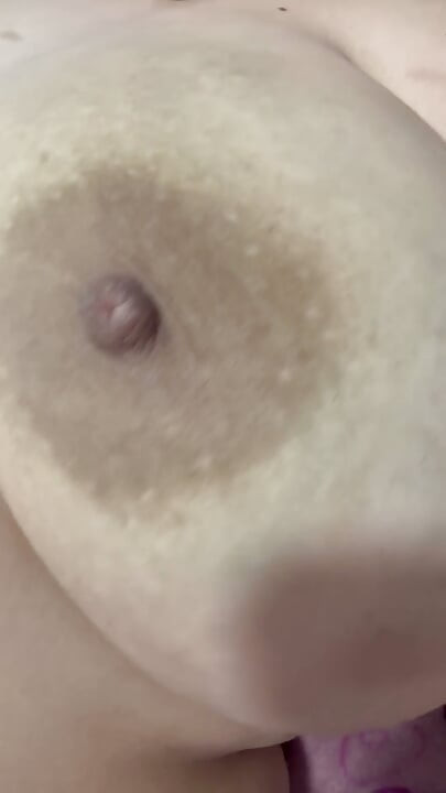 Mom plays with her big and delicious nipples