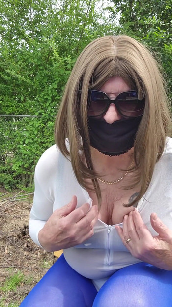 Key moment from "Gay Sexy Cd outdoors teasing and caressing myself in nylon tights, leotard, miniskirt."
