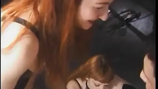 Hot dominatrix in leather with a great body puts a guy in clamps