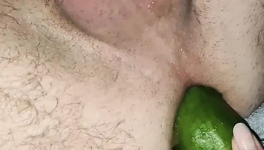 My wife is fucking my ass with a huge cucumber.