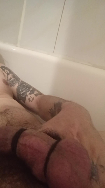 Big tattooed tied up cock , stroking in bathtub