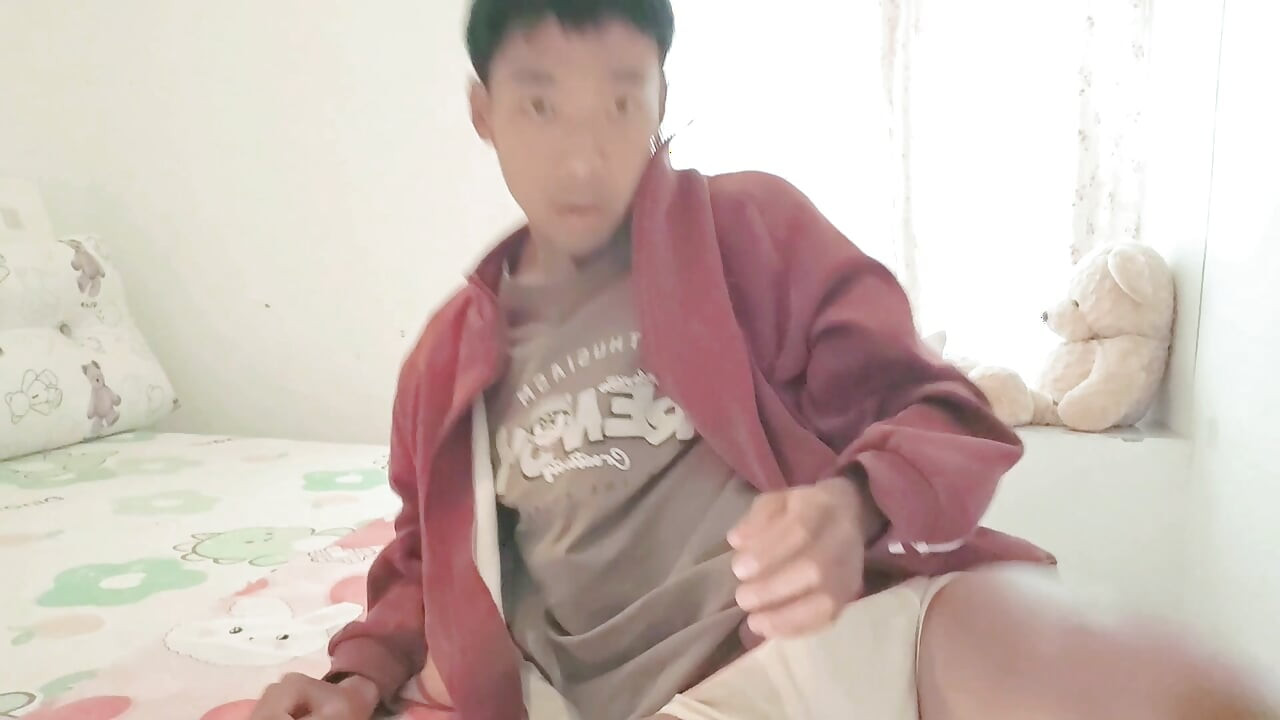Asian boy masturbates in his cozy dorm room, ejaculating large amounts of semen