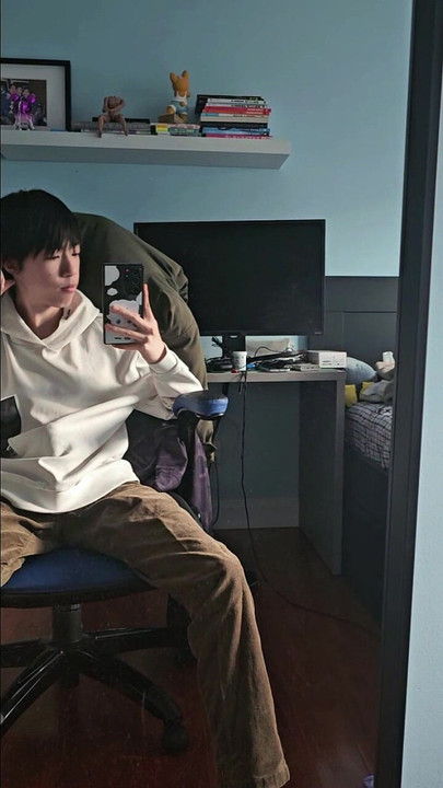 Asian boy taking selfie in front of mirror and secretly get hard