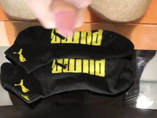 Cum on black Puma socks