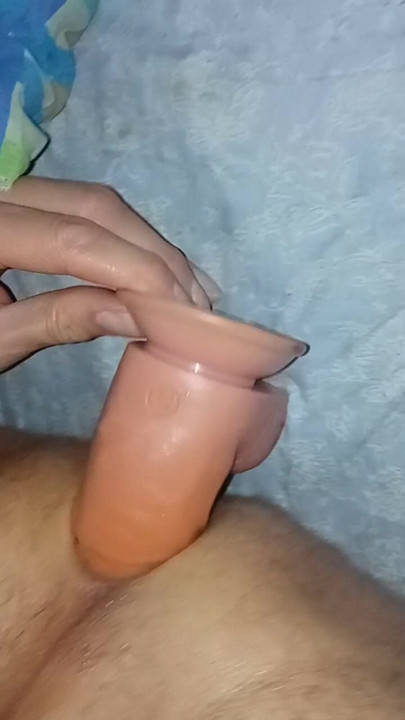Every woman needs a vibrator. Having fun in bed at night. Sissy Lady anal pleasure.