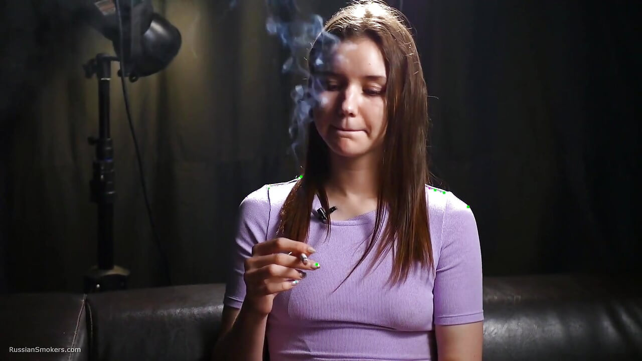 18 Aged Girl Is Smoking Two Strong Cork Cigarettes