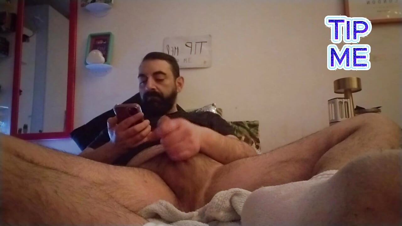 Lextalon jerks off on bed looking at the phone - powerful cumshot