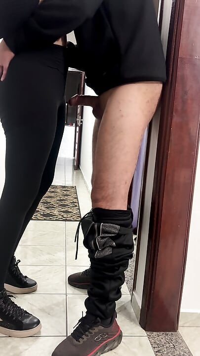 Coworkers hook up and have sex in the company hallway.