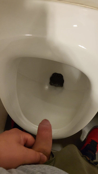 Man peeing in urinal