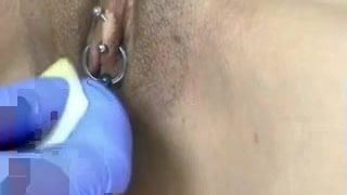Horizontal clit hood piercing