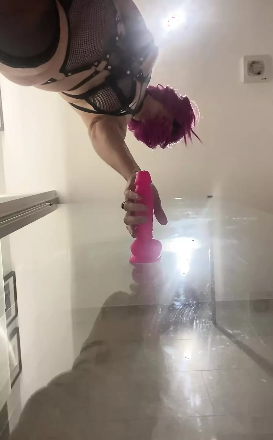 50+ in the Bathroom with her toys