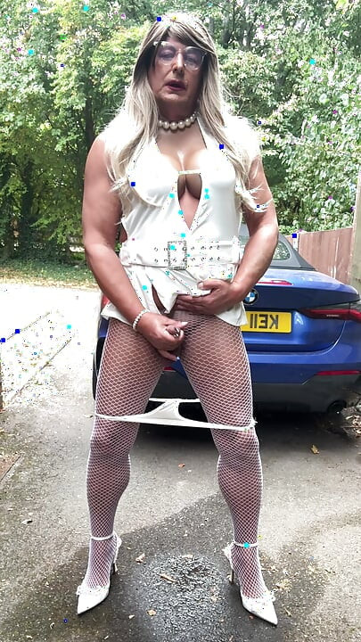 Sexy Crossdresser kellycd2022 in sexy white mini dress and fishnet pantyhose and heels