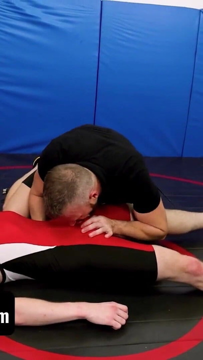 Captivating moment from "Varsity Grip - Hunk Coach Brian Bonds Drills Young Twink Wrestler In Spandex After Practice"