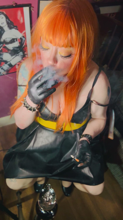Redhead Tina Snua Smoking 2 Cigarettes At A Time Wearing A Leather Dress & Gloves | Clip 1