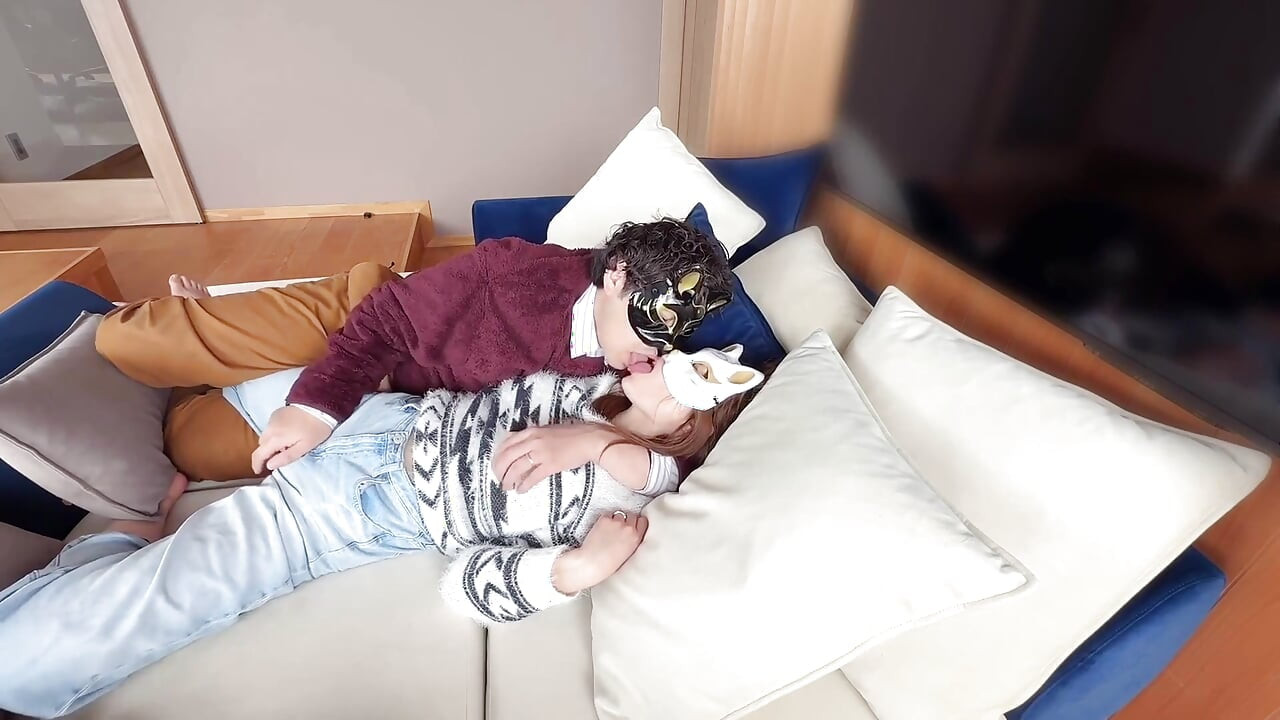 On the Sofa in Their Secret Room, They Shared Passionate Kisses Before Making Love, Expressing Their Deep Love.