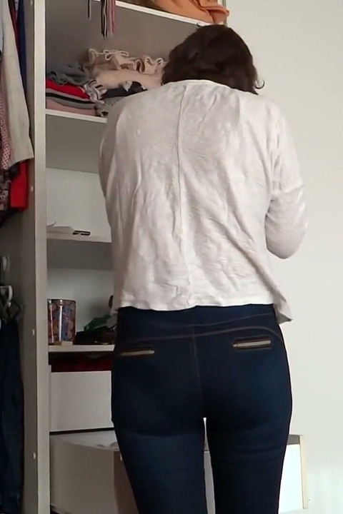 After Urinating, the Stepmother Puts on Very Tight Jeans, Revealing Her Panties