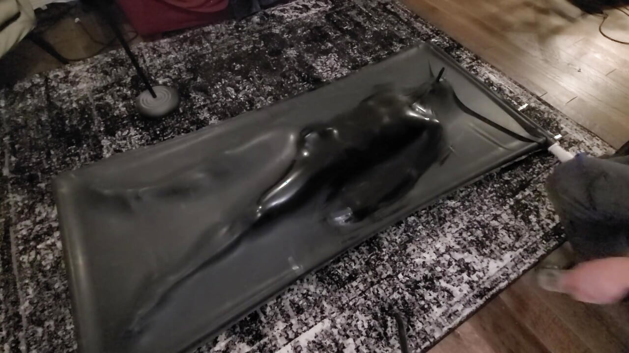 Cute twink tormented in latex vacbed