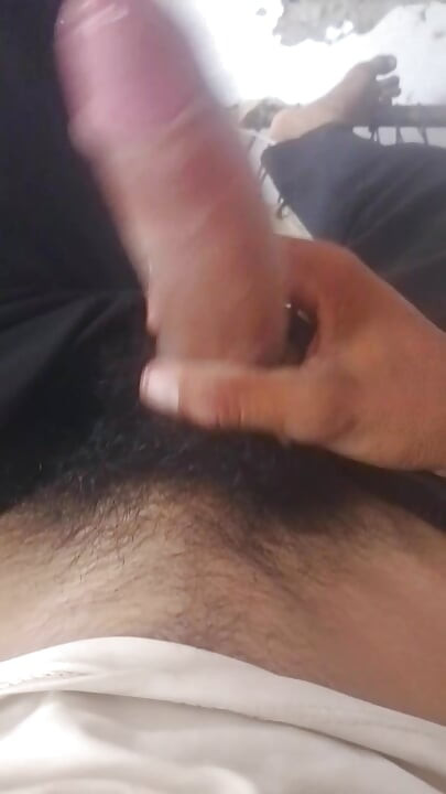 I'm masturbating right now, shaking my penis vigorously, trying to get the water out