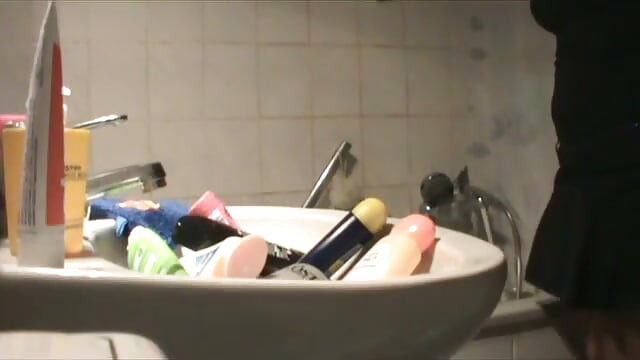 Brunette MILF with big boobs and round ass masturbating in the bathtub