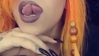 Sexy babe shows off her split tongue