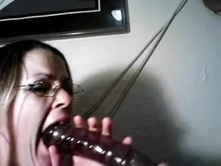 amateur MILF tries to swallow a big dildo