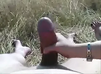 handjob till cumshot on fat cock outside