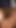 Key moment from "After catching the blonde babe masturbating the brunette milf and her hubby invite her into an anal threesome"