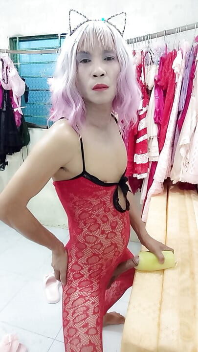 Oanh Le transgender wearing pornographic pantyhose playing with a can of pretense pleasure