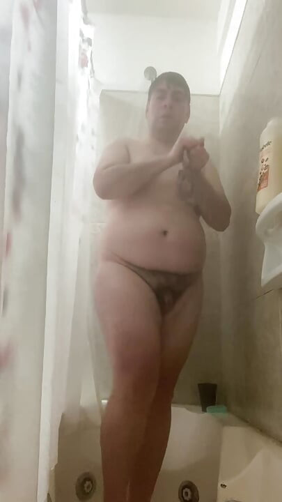 Alone in thong in the bathroom showing her ass and pussy pissing