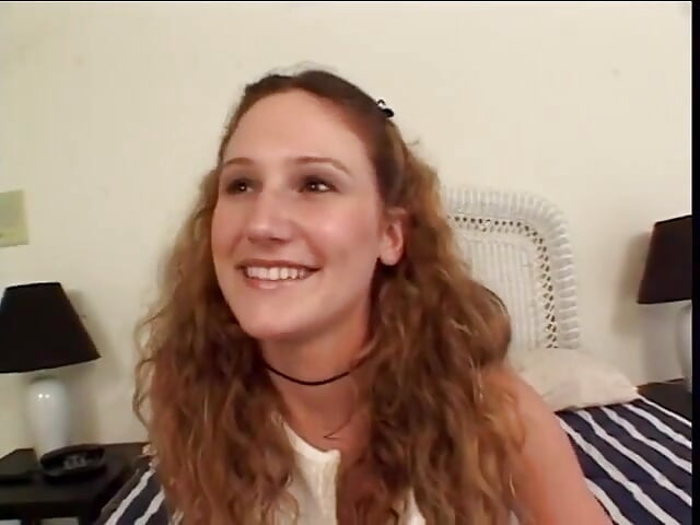 Young curly haired teen keeps her socks on