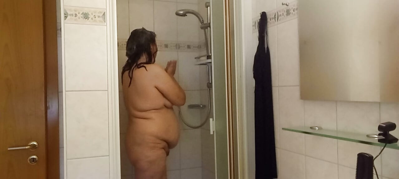 Chubby mature woman in the shower - soft belly - part 2