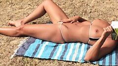 Watching wife sunbathing and flashing her hot bikini at park