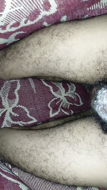 Handsome young man masturbating his large cock without a condom - twink with a big dick - stroking a black cock.