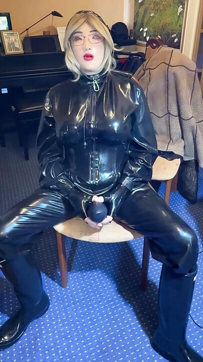 the latex slave has to do it himself