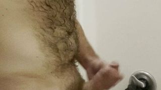 Stroking cock in the shower
