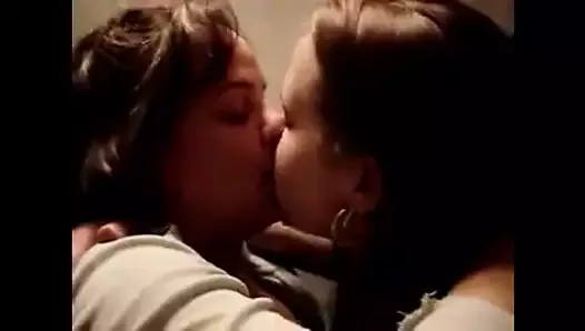Friends kissing on camera