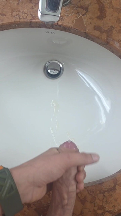 Secretly jerking off and cumming in the hotel bathroom while a friend can just walk in.