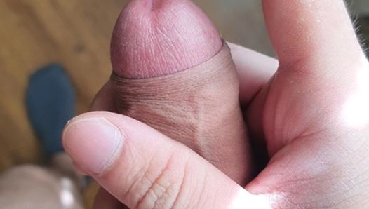 Jerking off a fat and uncircumcised cock