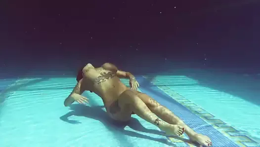 Heidi Van Horny with huge tits underwater