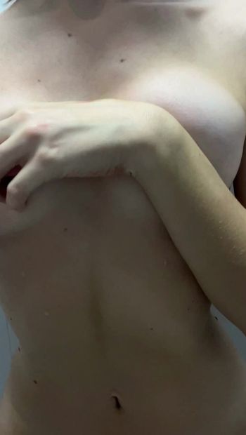 sexy girl teasing nude body in bathroom