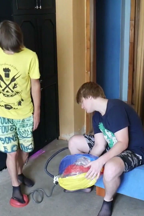 Thin, black socks blowing up balloons + footjob