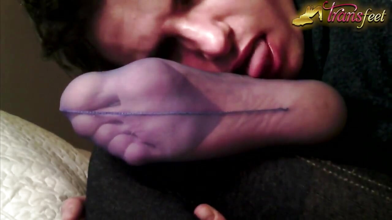 Trans is licking foot in pantyhose and masturbates