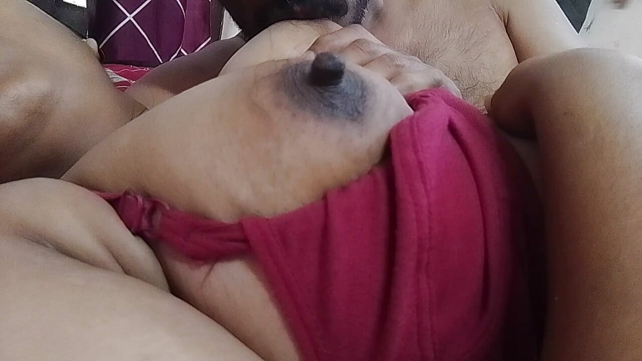 Her husband is sucking the housewife's breasts.