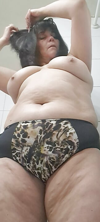 Milf pulling down her panties showing her hairy pussy and ends up brushing her teeth, part 2