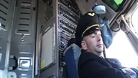Randy pilot fondles sexy brunette in the cockpit
