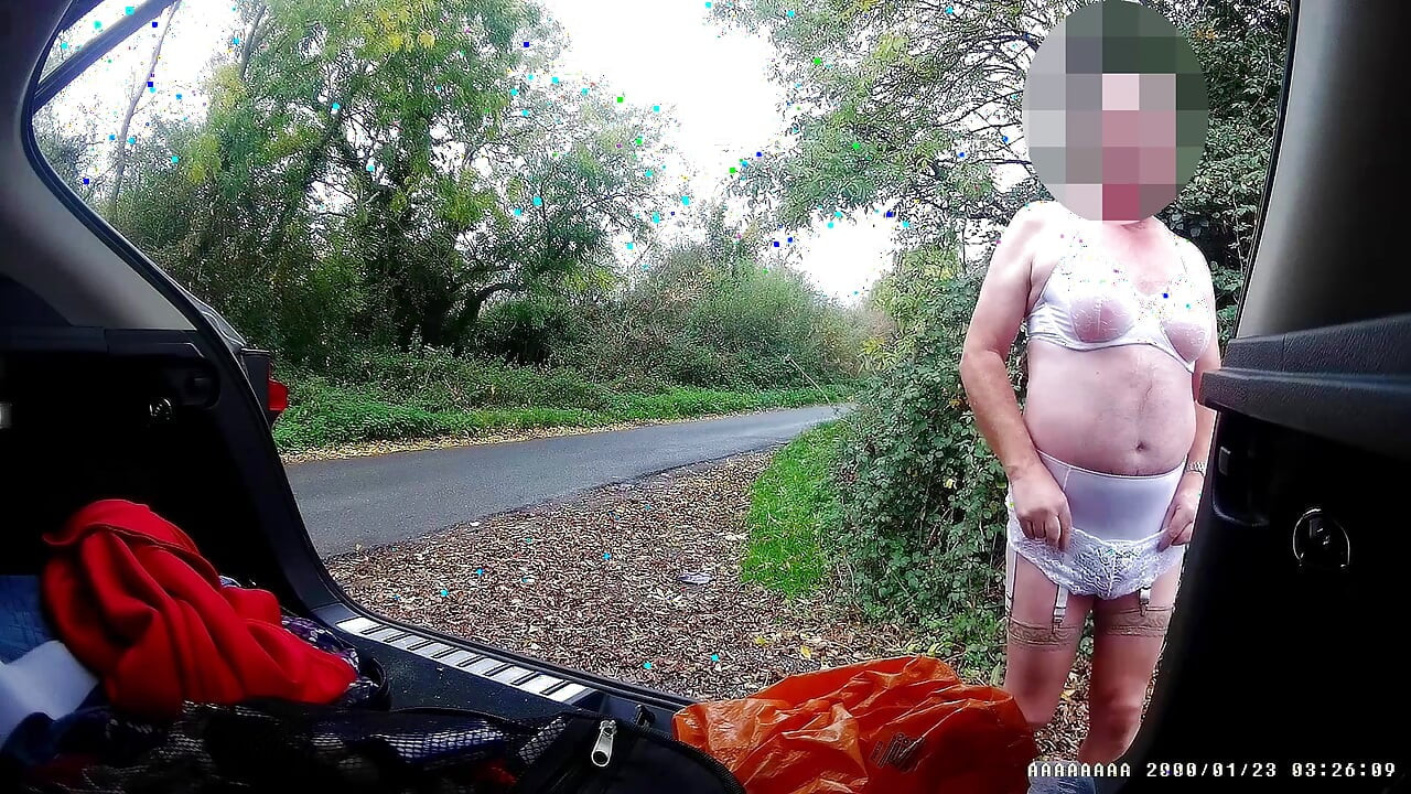 Just getting changed parked at side of road with cars driving past