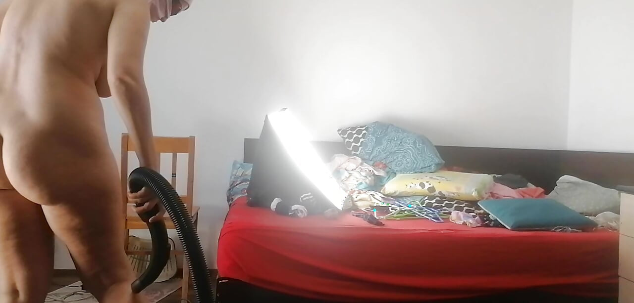 Amateur wife vacuuming in the bedroom. Sexy naked wife preparing food in the kitchen.