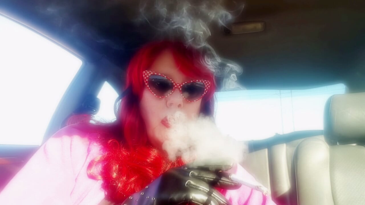 Mature Redhead Wearing LeatherGloves -Holder Smoking VS120 in Car