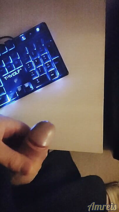 Gamer in the night. Cum on table.